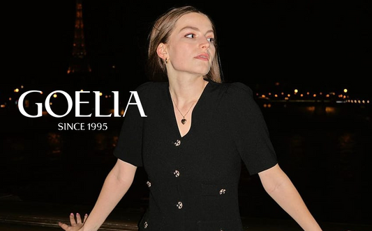 a lady in black v-neck knitted dress