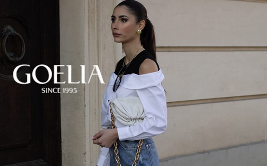 a lady in a faux two-piece and off the shoulder top and a pair of jeans