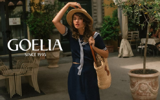 a lady in a black tencel blend knit top and skirt