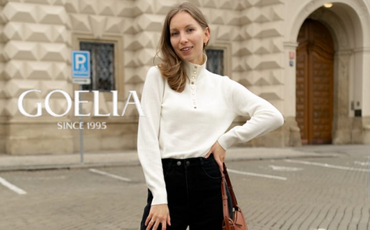 a lady in a white top and a pair of black jeans