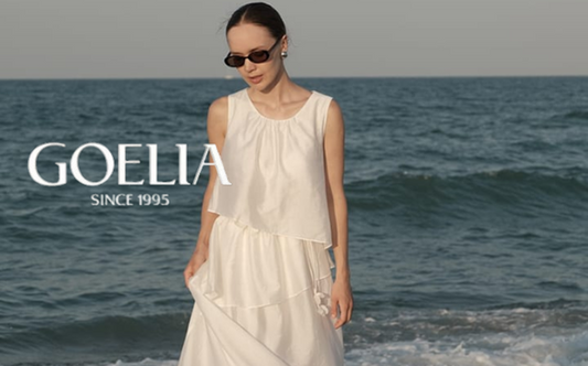 a lady in a white tencel blend tiered dress