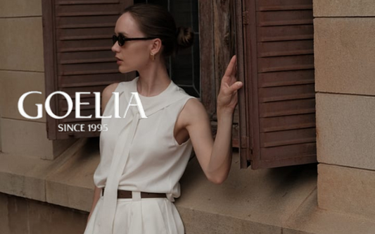 a lady in a white vest and a pair of white shorts