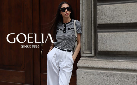 a lady in a striped top and a pair of white jeans