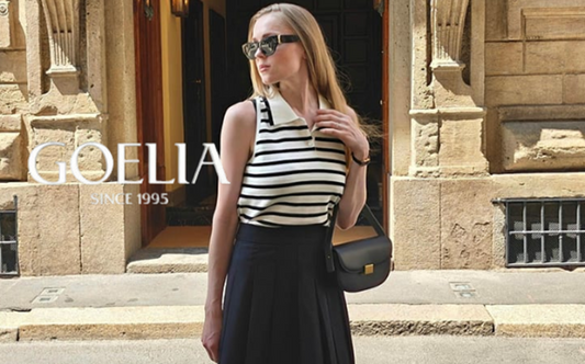 a lady in a striped polo shirt and a black pleated skirt