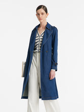 A lady wears a denim lapel trench coat.