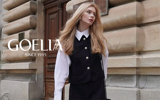 a lady wears a white shirt with s black tweed vest 