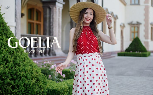 a lady in a red halter top and a white skirt with polka dots