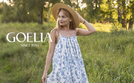 a lady in a blue floral printed slip dress