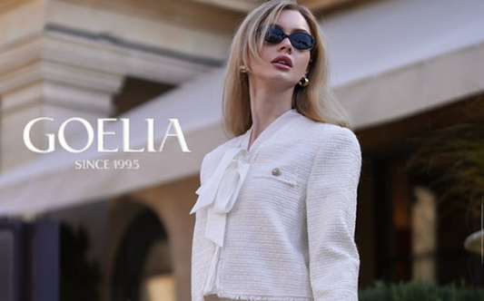 a lady in a white tweed jacket and a white tweed skirt