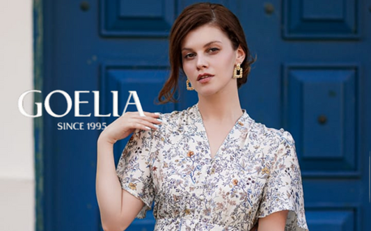 a lady in a blue floral printed silk dress