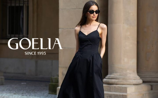 a lady in a black sleeveless slip dress