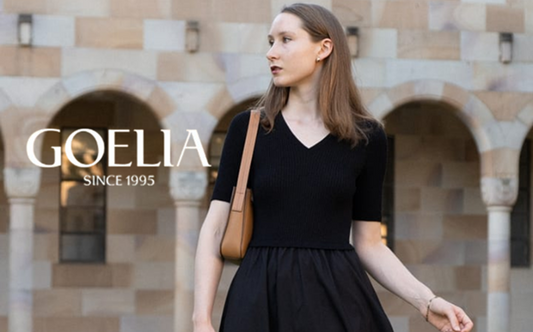 a lady in a plain black v-neck patchwork dress