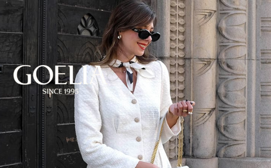 a lady in a white tweed v-neck dress