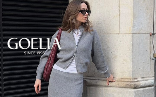 a lady in a white top, a grey wool cardigan and skirt two-piece set