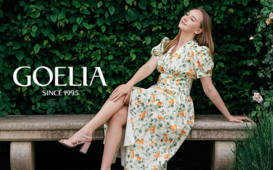 a lady in a green orange printed dress