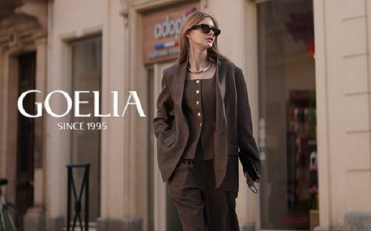 a lady in a brown wool vest, a brown wool blazer and a pair of brown wool pants