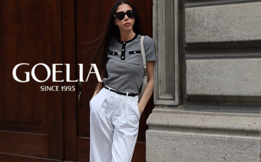 a lady in a striped knit top and a pair of white jeans