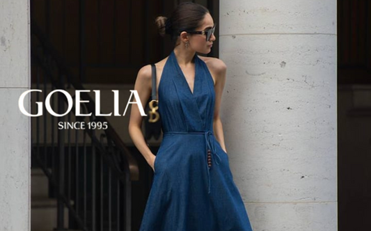 a lady in a denim halter dress with a belt
