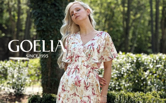 a lady in a pink floral printed silk dress