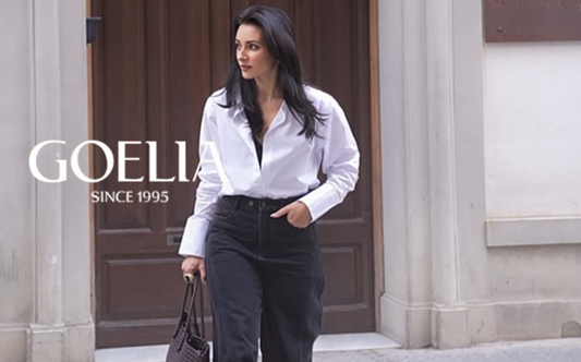 a lady in a white shirt and a pair of black jeans