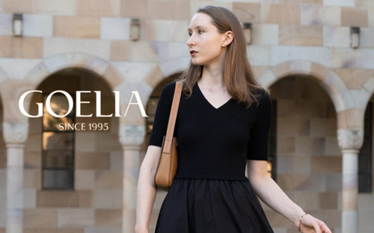 a lady in a black tencel v-neck patchwork dress