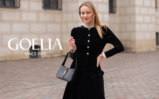a lady in a black velvet ruffle collar dress