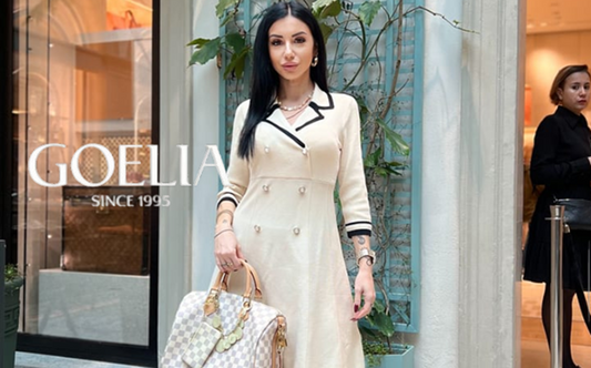 a lady in a white double-breasted lapel A-line dress