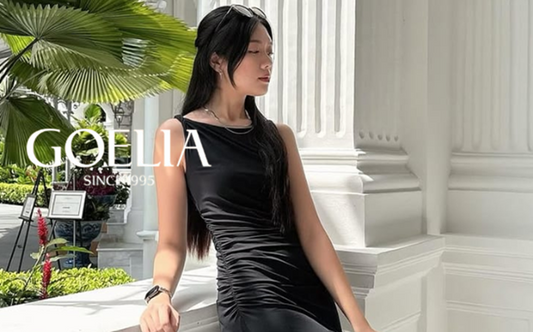 a lady in a black vest maxi dress