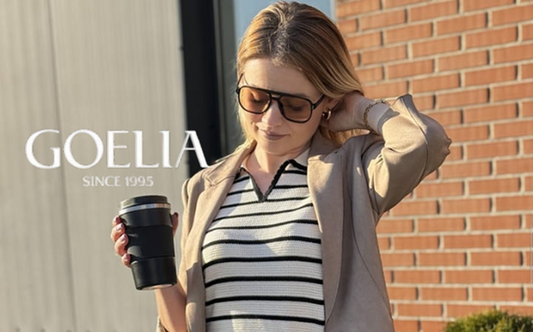 a lady in a striped polo shirt and a faux suede blazer
