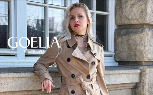 a lady in a brown coat with a belt