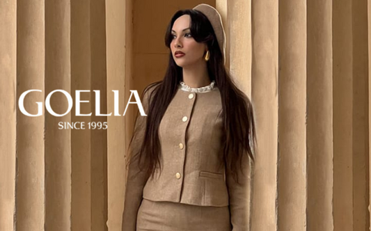 a lady in a brown jacket and a brown skirt