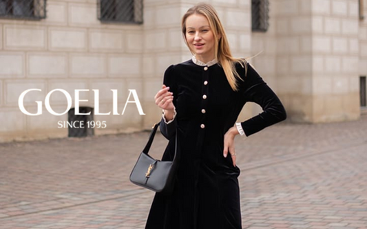 a lady in a black velvet ruffle collared dress