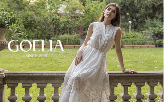 a lady in a white tencel embroidered dress