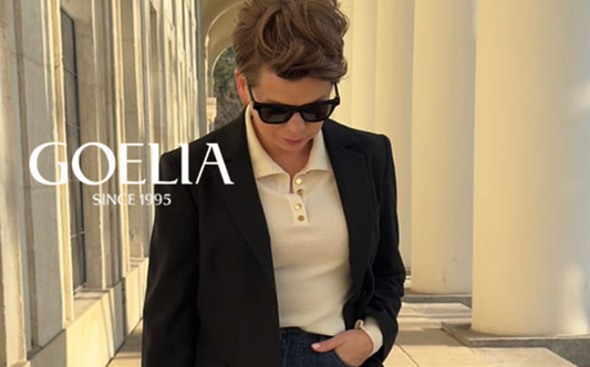 a lady in a beige lapel T-shirt, a black blazer and a pair of jeans