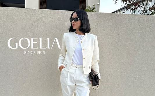 a lady in a white T-shirt with white crop jacket and pants 