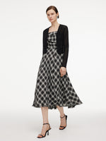 [Preview] Plaid Fringed Hem Strap Dress And Cardigan Two-Piece Set GOELIA